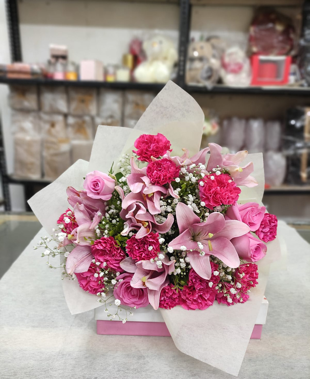 4 Pink Lilies, 8 Pink Roses And 12 Pink Carnation Bunch With Paper Packing
