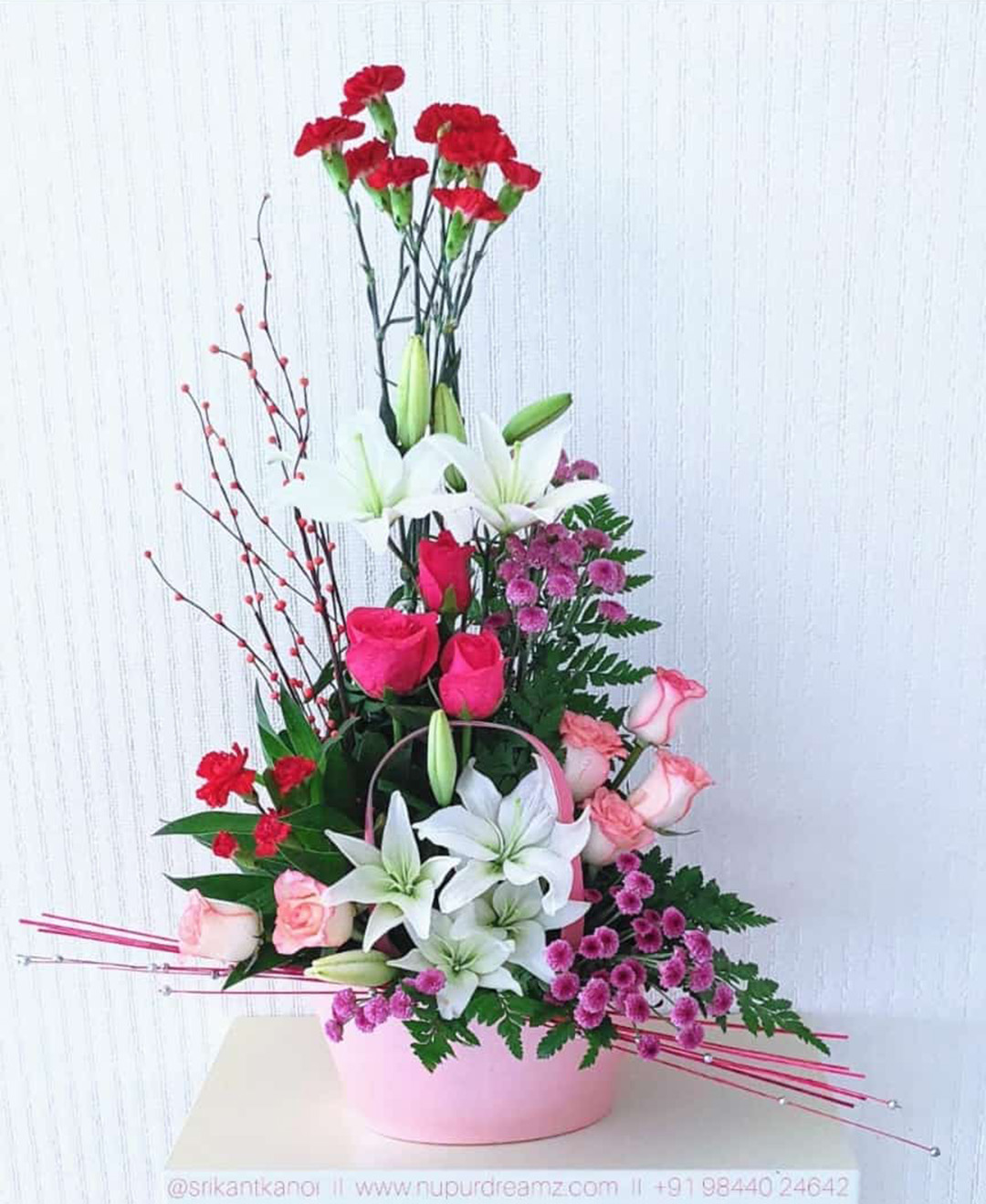 White Lilies, Pink Roses and Red Carnation With Purple Chysamthimun Basket