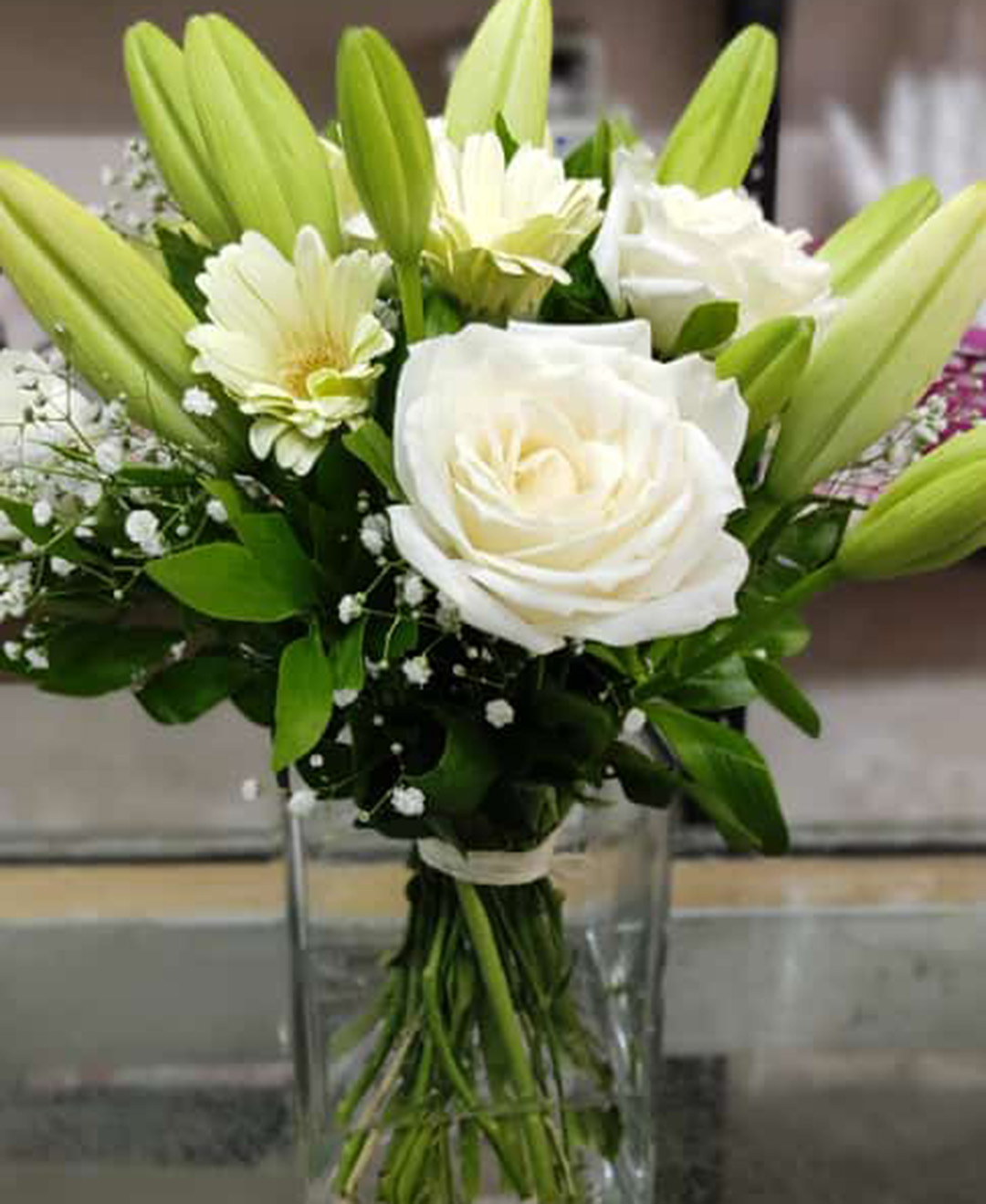 3 White Lilies, 5 White Roses And 5 White Gerbera Glass Vase