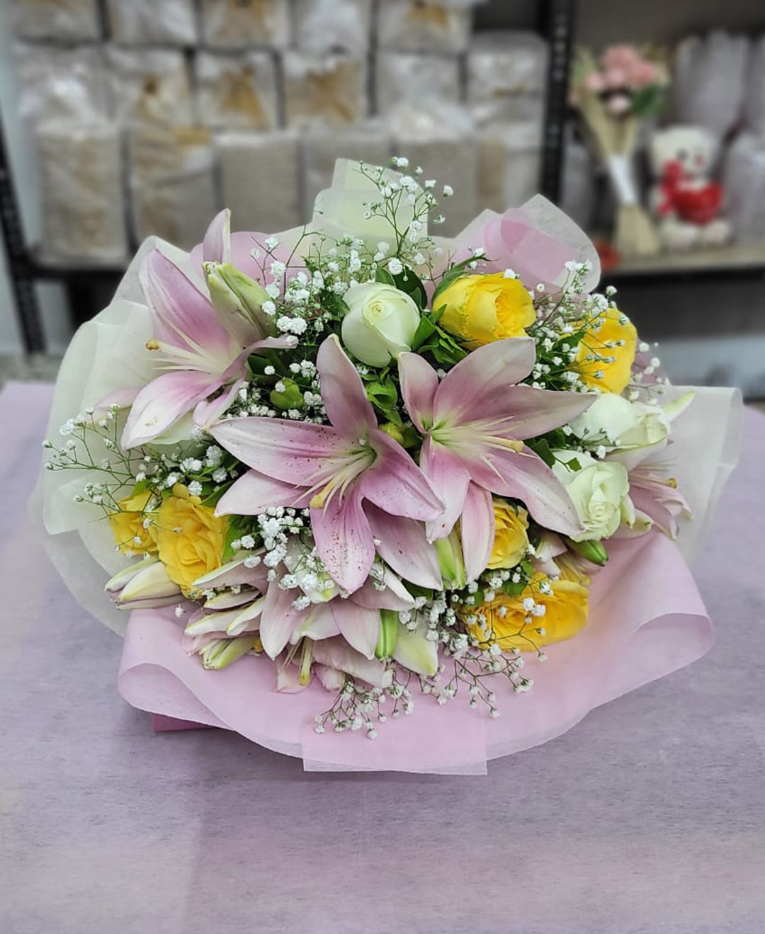 12 White And Yellow Roses And 3 Pink Lilies Bunch With Paper Packing